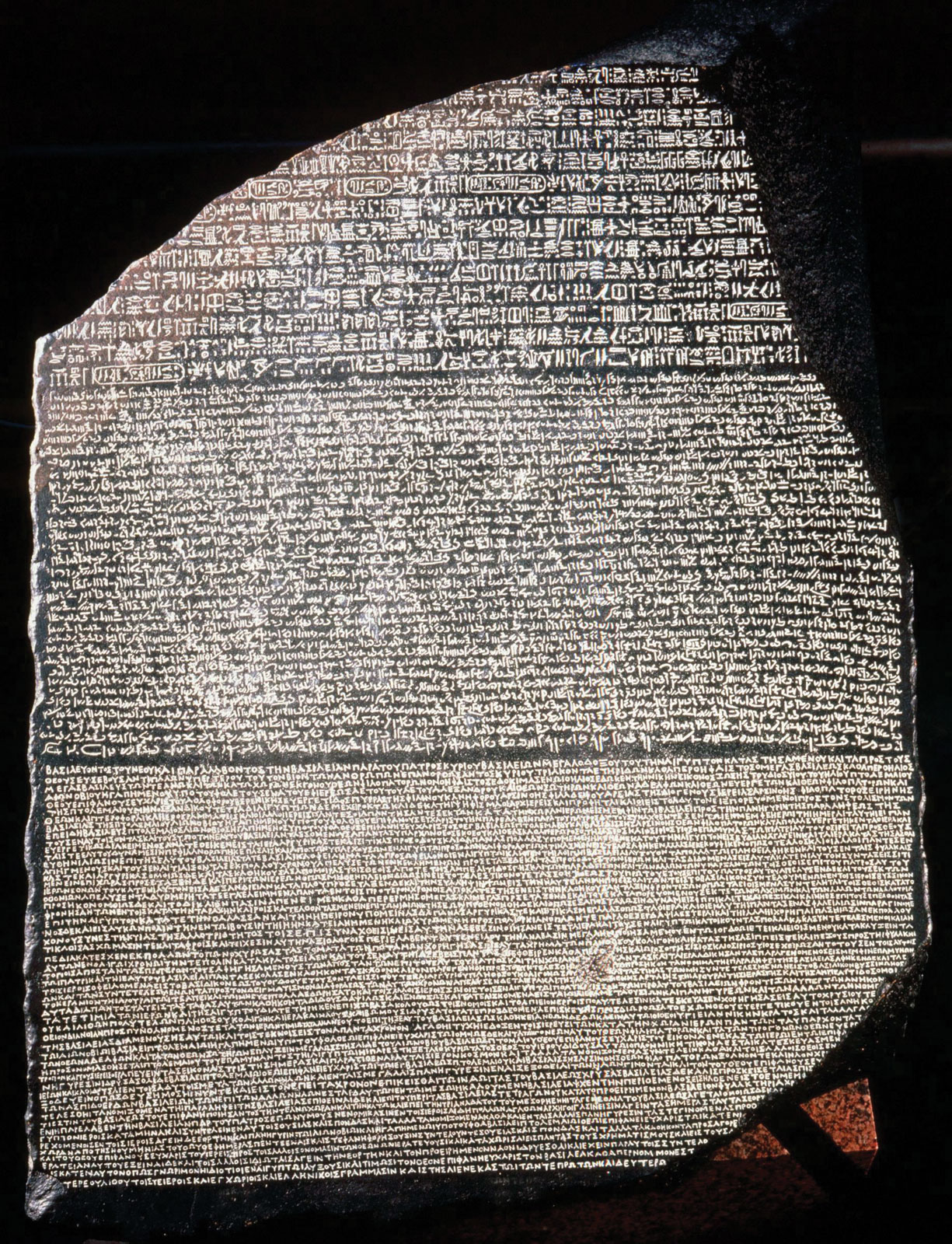 The Rosetta Stone basalt slab from Fort Saint-Julien Egypt 196 BCE in the British Museum London